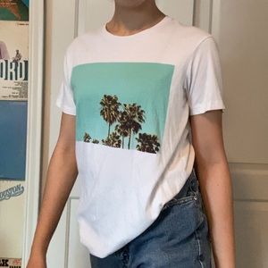 White tee shirt with palm tree and sky decal